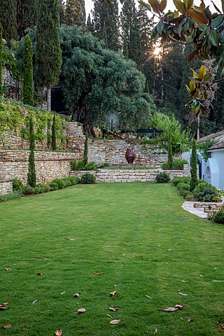 KOULOURA_CORFU_GREECE_DESIGNER_PAUL_BANGAY_LAWN_WALLS_TERRACES_WATER_FEATURE_TERRACOTTA_CONTAINERS