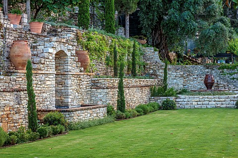 KOULOURA_CORFU_GREECE_DESIGNER_PAUL_BANGAY_LAWN_WALLS_TERRACES_WATER_FEATURE_TERRACOTTA_CONTAINERS