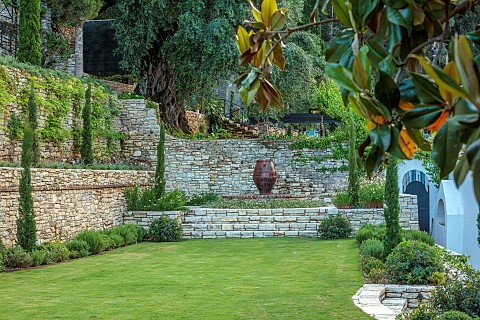 KOULOURA_CORFU_GREECE_DESIGNER_PAUL_BANGAY_LAWN_WALLS_TERRACES_WATER_FEATURE_TERRACOTTA_CONTAINERS