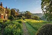 CAISSON GARDEN, SOMERSET: THE FRONT GARDEN, MEADOW, PATH, PARTERRE, CLIPPED YEW, BOX TOPIARY