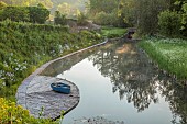 CAISSON GARDEN, SOMERSET: VIEW TO THE POUND, A DEEP POND, WATER, POOL, CANAL, DECKING, BOAT, REFLECTIONS, REFLECTED