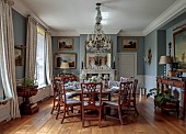 PRIORS MARSTON, WARWICKSHIRE, THE MANOR HOUSE: THE FORMAL DINING ROOM, PALE BLUE, CANDELABRA, DINNER SERVICE HAND PAINTED BY DEBORAH SEARS, ISIS CERAMICS
