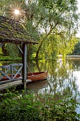PRIORS MARSTON, WARWICKSHIRE, THE MANOR HOUSE: THE LAKE, BOATHOUSE, BOAT HOUSE, MAY, SUNSET