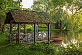 PRIORS MARSTON, WARWICKSHIRE, THE MANOR HOUSE: THE LAKE, BOATHOUSE, BOAT HOUSE, MAY, SUNSET