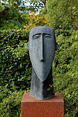 HIGHFIELD FARM, MONMOUTHSHIRE: LONG FACE SCULPTURE BY DENNIS FAIRWEATHER ON CORTEN STEEL PLINTH
