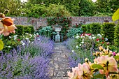 THE MANOR HOUSE, BLEDLOW, BUCKINGHAMSHIRE: MAY, THE WALLED KITCHEN, VEGETABLE GARDEN, PEONIES, CATMINT, PATH, URN, ROSE HIGHGROVE