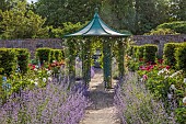 THE MANOR HOUSE, BLEDLOW, BUCKINGHAMSHIRE: MAY, THE WALLED KITCHEN, VEGETABLE GARDEN, PEONIES, CATMINT AND ROSE PHYLLIS BIDE CLIMBING UP CENTRAL GAZEBO