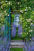 THE MANOR HOUSE, BLEDLOW, BUCKINGHAMSHIRE: MAY, MURAL OF VERTUMNUS IN THE MANNER OF ARCHIMBOLDO BY OWEN TURVILLE, ARBOUR, ROSA CERISE BOUQUET, NEPETA WALKERS LOW, PATH, VISTA