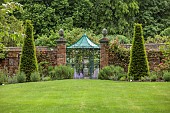 THE MANOR HOUSE, BLEDLOW, BUCKINGHAMSHIRE: LAWN, WALLED GARDEN, GATE, YEW, ARBOUR