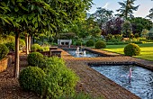 THE MANOR HOUSE, BLEDLOW, BUCKINGHAMSHIRE: THE FISH PONDS, FOUNTAINS, STONE SEAT, BENCH, LAWN