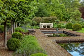 THE MANOR HOUSE, BLEDLOW, BUCKINGHAMSHIRE: THE FISH PONDS, FOUNTAINS, STONE SEAT, BENCH, LAWN