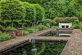 THE MANOR HOUSE, BLEDLOW, BUCKINGHAMSHIRE: THE FISH PONDS, FOUNTAINS, STONE SEAT, BENCH, LAWN
