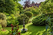 THE MANOR HOUSE, BLEDLOW, BUCKINGHAMSHIRE: MAY, WATER SCULPTURE BY BARRY MASON, RAMNUS, ELEAGNUS, SAMBUCUS NIGRA, HYDRANGEA ANNABELLE