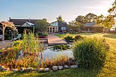 TYTHE BARN, OXFORDSHIRE, DESIGNER SARAH NAYBOUR: JUNE, WILDLIFE POND, DECKING, LAWN, POOL, WATER