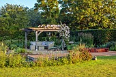 TYTHE BARN, OXFORDSHIRE, DESIGNER SARAH NAYBOUR: JUNE, DECKING, POOL, WILDLIFE POND, OAK PERGOLA, ROSES