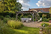 TYTHE BARN, OXFORDSHIRE, DESIGNER SARAH NAYBOUR: JUNE, OAK PERGOLA, SEATING, ENTERTAINING
