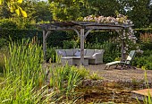 TYTHE BARN, OXFORDSHIRE, DESIGNER SARAH NAYBOUR: JUNE, OAK PERGOLA, SEATING, ENTERTAINING, ROSES