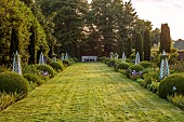 OLD BLADBEAN STUD GARDENS, KENT: JUNE, MIRRORED BORDERS, LAWN, STONE SEAT, OBELISKS, IRIS BRAITHWAITE