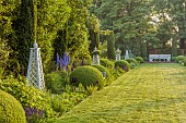OLD BLADBEAN STUD GARDENS, KENT: JUNE, MIRRORED BORDERS, LAWN, STONE SEAT, OBELISKS, DELPHINIUMS