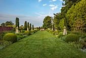 OLD BLADBEAN STUD GARDENS, KENT: JUNE, MIRRORED BORDERS, LAWN, STONE SEAT, OBELISKS, DELPHINIUMS, IRIS BRAITHWAITE