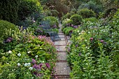 OLD BLADBEAN STUD GARDENS, KENT: JUNE, THE ROSE GARDEN, PATH, METAL SEAT, PHUOPSIS STYLOSA, ALLIUM CHRISTOPHII, SEDUMS, GERANIUM PRATENSE F ALBUM