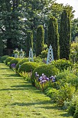 OLD BLADBEAN STUD GARDENS, KENT: JUNE, MIRRORED BORDERS, LAWN, STONE SEAT, OBELISKS, IRIS BRAITHWAITE