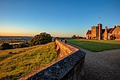 ROCKINGHAM CASTLE, NORTHAMPTONSHIRE: JUNE, THE CASTLE AND TERRACE LAWN WITH VIEWS TO THE COUNTRYSIDE BEYOND