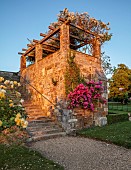 ROCKINGHAM CASTLE, NORTHAMPTONSHIRE:JUN, THE BANDSTAND, WHITE ROSE, ROSA RAMBLING RECTOR, PINK ROSE, ROSA MRS F W FLIGHT, SUNSET, STEPS