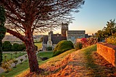 ROCKINGHAM CASTLE, NORTHAMPTONSHIRE: JUNE, TERRACE ABOVE THE CROSS GARDEN AT SUNSET