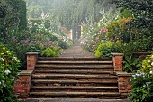 COTTESBROOKE HALL AND GARDENS, NORTHAMPTONSHIRE: THE TERRACE, DOUBLE HERBACEOUS BORDERS, STEPS, ONOPORDUM ACANTHIUM, HYDRANGEA EMILE MOUILLERE, DAHLIA HONKA ROSE