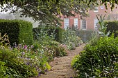 COTTESBROOKE HALL AND GARDENS, NORTHAMPTONSHIRE: THE TERRACE, DOUBLE HERBACEOUS BORDERS, ONOPORDUM ACANTHIUM, GERANIUMS, ALCHEMILLA MOLLIS