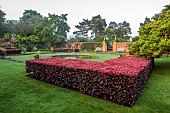 COTTESBROOKE HALL AND GARDENS, NORTHAMPTONSHIRE: DAWN, SUNRISE, THE POOL GARDEN, FOUNTAIN, POND, WATER, LAWN, CEDAR OF LEBANON, COPPER BEECH HEDGE, WALL, WALLED