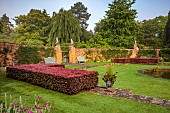 COTTESBROOKE HALL AND GARDENS, NORTHAMPTONSHIRE: DAWN, SUNRISE, THE POOL GARDEN, FOUNTAIN, POND, WATER, LAWN, CEDAR OF LEBANON, COPPER BEECH HEDGE, WALL, WALLED