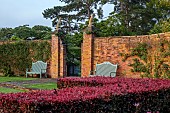 COTTESBROOKE HALL AND GARDENS, NORTHAMPTONSHIRE: DAWN, SUNRISE, THE POOL GARDEN, WOODEN BENCHES, COPPER BEECH HEDGE, WALL, WALLED