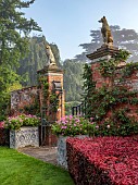 COTTESBROOKE HALL AND GARDENS, NORTHAMPTONSHIRE: DAWN, SUNRISE, THE POOL GARDEN, COPPER BEECH HEDGE, WALL, WALLED, HEDGING, GATE
