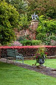 COTTESBROOKE HALL AND GARDENS, NORTHAMPTONSHIRE: THE POOL GARDEN, COPPER BEECH HEDGE, WALL, WALLED, HEDGING, CONTAINER, BENCH, LAWN