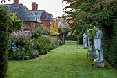 COTTESBROOKE HALL AND GARDENS, NORTHAMPTONSHIRE: STATUE WALK, BORDERS, PHLOX PANICULATA COOL OF THE EVENING, DELPHINIUN PINK RUFFLES, VERONICASTRUM VIRGINICUM ALBUM