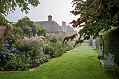 COTTESBROOKE HALL AND GARDENS, NORTHAMPTONSHIRE: STATUE WALK, DAWN, BORDERS, PHLOX PANICULATA COOL OF THE EVENING, DELPHINIUN PINK RUFFLES, VERONICASTRUM VIRGINICUM ALBUM