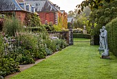COTTESBROOKE HALL AND GARDENS, NORTHAMPTONSHIRE: STATUE WALK, DAWN, BORDERS, VERONICASTRUM VIRGINICUM ALBUM