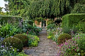 COTTESBROOKE HALL AND GARDENS, NORTHAMPTONSHIRE: THE TERRACE, DOUBLE HERBACEOUS BORDERS, ONOPORDUM ACANTHIUM, LUPINS, ALCHEMILLA MOLLIS