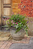 COTTESBROOKE HALL AND GARDENS, NORTHAMPTONSHIRE: STONE CONTAINERS IN THE OLD LAUNDRY YARD