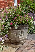 COTTESBROOKE HALL AND GARDENS, NORTHAMPTONSHIRE: STONE CONTAINERS IN THE OLD LAUNDRY YARD