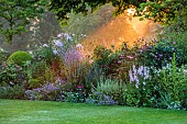 MORTON HALL GARDENS, WORCESTERSHIRE: SOUTH GARDEN, JULY, BORDER, SUNRISE, PEROVSKIA BLUE SPIRE, PHLOX, ECHINACEA