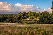 PLAS CADNANT, WALES: VIEW OF THE GARDEN AT PLAS CADNANT, JULY, SUNRISE