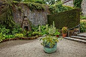 PLAS CADNANT, WALES: JULY, WALLED GARDEN, WATER FEATURE, FOUNTAIN, FERNS, COPPER CONTAINER PLANTED WITH ACANTHUS MOLLIS RUE LEDAN