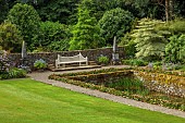 PLAS CADNANT, WALES: LAWN, POND, POOL, WHITE WOODEN BENCH, SEAT, CORNUS CONTROVERSA VARIEGATA