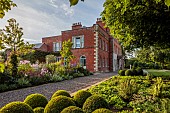 MORTON HALL GARDENS, WORCESTERSHIRE: SOUTH GARDEN, AUGUST, LAWN, BORDERS, PEROVSKIA, SIDALCEA ELSIE HEUGH, PHLOX, ECHINACEA MORTON HALL, CLIPPED BOX BALLS