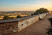 ROCKINGHAM CASTLE, NORTHAMPTONSHIRE: SUNRISE, VIEW OVER TERRACE TO COUNTRYSIDE BEYOND, BORROWED LANDSCAPE