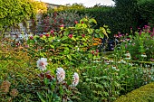 ROCKINGHAM CASTLE, NORTHAMPTONSHIRE: BORDER, DAHLIA, CALYCANTHUS X RAULSTONII HARTLAGE WINE, SHRUBS, CAROLINA ALLSPICE