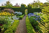 ROCKINGHAM CASTLE, NORTHAMPTONSHIRE: BORDER, SCABIOSA PERFECTION BLUE, GLADIOLUS EVERGREEN, HEMEROCALLIS GOLDEN CHIMES, RUDBECKIA AUTUMN FOREST, WEIGELIA, AGAPANTHUS, YEW HEDGE